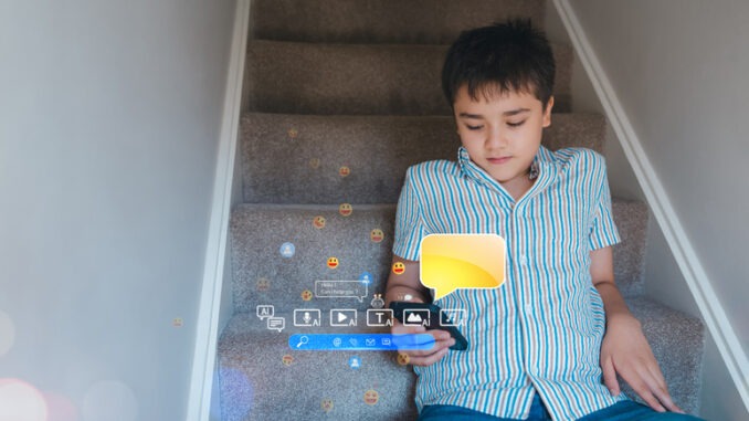 Teenager using smartphone chatting with friends and learning music from AI chatbot.Concept for online education,digital lifestyle, social media, virtual interaction,e-learningonline behaviour concepts