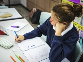 Student woman studying in the clsaarom