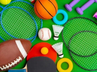 Composition of various sport equipment for fitness and games. Close up.