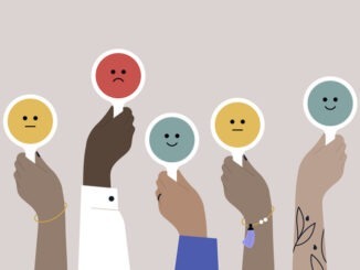 A diverse crowd of people displaying signs with mixed reactions, bad, good, and neutral