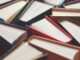 Many hardbound books background, selective focus