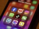 Portland, OR, USA - Nov 11, 2024: Some of the most popular social media apps by number of monthly active users, including Facebook, YouTube, Instagram, WhatsApp, TikTok, WeChat, Telegram, Messenger, and Snapchat, are seen on an iPhone.